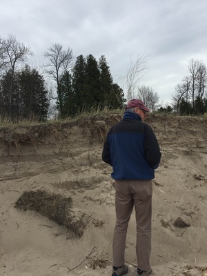Dune scarp with 6 ft man for perspective